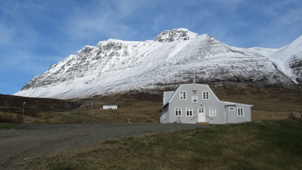 The Arctic Fox Centre building in Súðavík, Iceland, a renovated farmhouse housing a research and exhibition centre