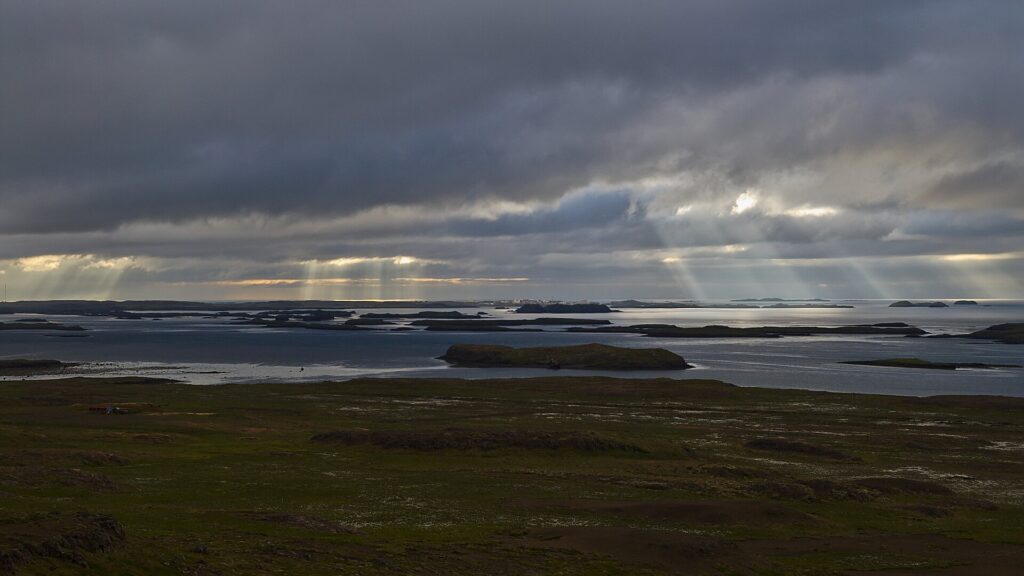 View across the islands and calm waters of Breiðafjörður bay in west Iceland