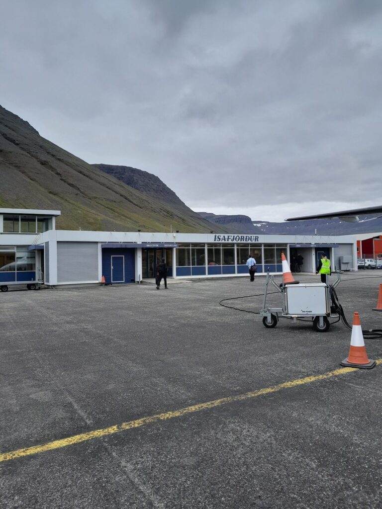 Ísafjörður Airport runway on a narrow spit of land surrounded by steep fjord mountains