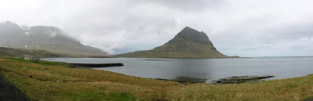 Kirkjufell mountain rising beside the coast road near Grundarfjörður on the Snæfellsnes peninsula